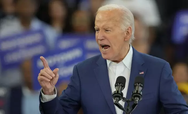 President Joe Biden gestures during his remarks at Renaissance High School during a Friday, July 12, 2024, campaign event in Detroit. (AP Photo/Carlos Osorio)