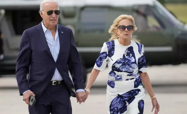 President Joe Biden, left, and first lady Jill Biden arrive on Marine One at East Hampton Airport, Saturday, June 29, 2024, in East Hampton, N.Y. (AP Photo/Evan Vucci)