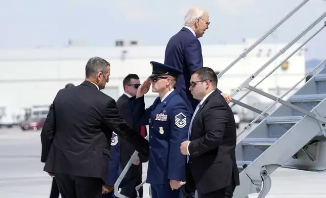 President Joe Biden walks up the steps of Air Force One at Harry Reid International Airport in Las Vegas, Wednesday, July 17, 2024. Biden has tested positive for the coronavirus, according to a speaker at the UnidosUS annual conference broadcast on the White House's YouTube channel. (AP Photo/Susan Walsh)