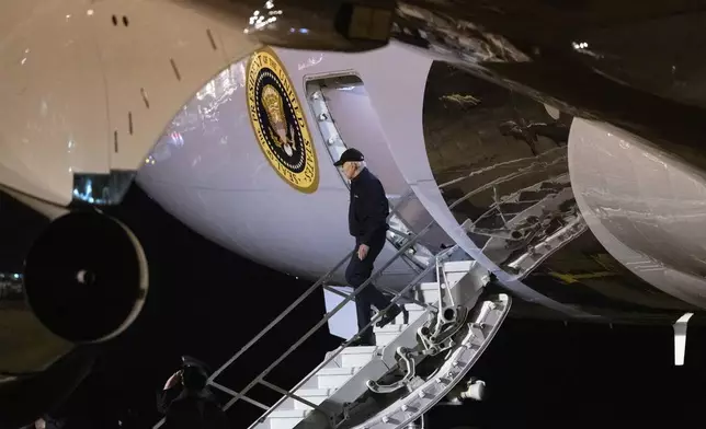 President Joe Biden disembarks Air Force One as he arrives at Dover Air Force Base, in Dover, Del., Wednesday, July 17, 2024, from a campaign trip in Las Vegas. Biden has tested positive for COVID-19 while traveling in Las Vegas and is experiencing "mild symptoms" from the infection. Biden is going to his Rehoboth Beach home, where he will "self-isolate and will continue to carry out all of his duties fully during that time." (AP Photo/Manuel Balce Ceneta)