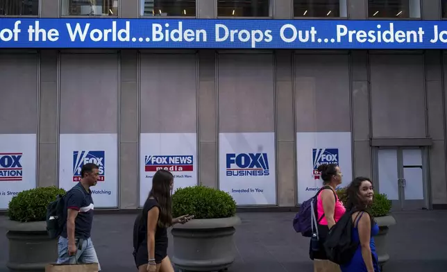 A news crawl appears on the side of the Fox News building in New York, Sunday, July 21, 2024, in the wake of President Joe Biden dropping out of the 2024 race for the White House. (AP Photo/Craig Ruttle)