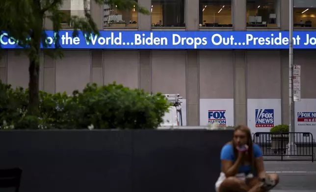 A news crawl appears on the side of the Fox News building in New York, Sunday, July 21, 2024, in the wake of President Joe Biden dropping out of the 2024 race for the White House. (AP Photo/Craig Ruttle)