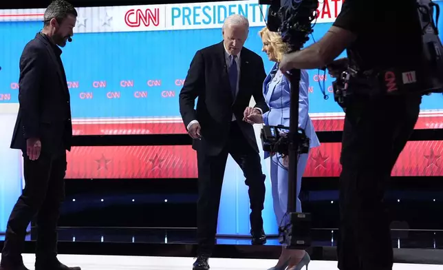 FILE - President Joe Biden, from second left, and first lady Jill Biden, walk off stage at the endof a presidential debate with Republican presidential candidate former President Donald Trump June 27, 2024, in Atlanta. (AP Photo/Gerald Herbert, File)