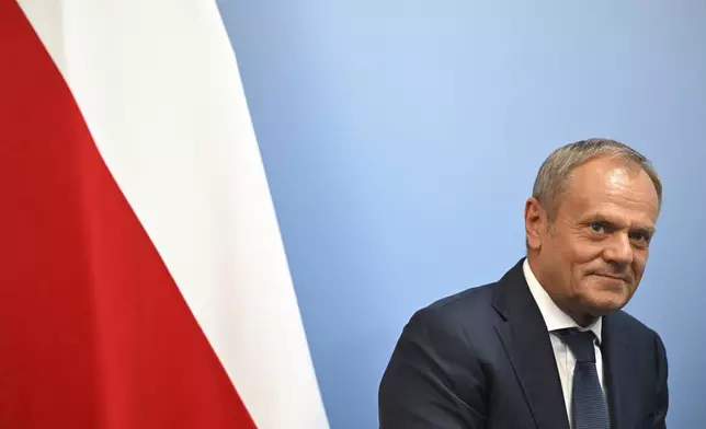 FILE - Poland's Prime Minister Donald Tusk reacts during a bilateral meeting with Britain's Prime Minister Keir Starmer, at the European Political Community meeting, at Blenheim Palace in Woodstock, southern England, Thursday, July 18, 2024. U.S. President Joe Biden's withdrawal from the U.S. presidential race injects greater uncertainty into the world. (Justin Tallis/Pool Photo via AP, File)