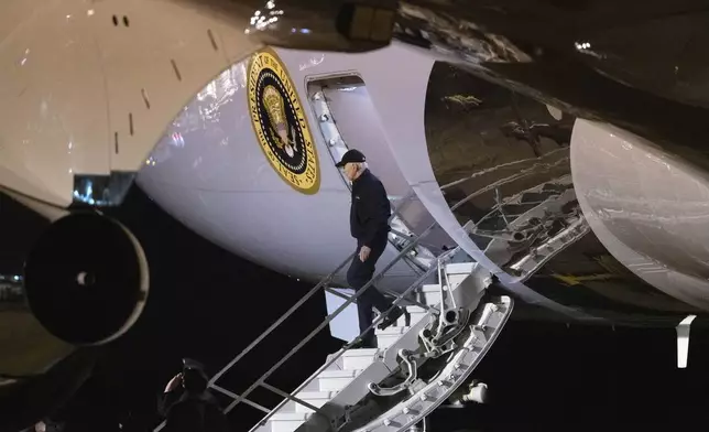 FILE - President Joe Biden disembarks Air Force One as he arrives at Dover Air Force Base, in Dover, Del., July 17, 2024, from a campaign trip in Las Vegas. Biden now is weighing whether to bow to the mounting pressure to exit the presidential race. He insists he's staying in, but his decision will be based not just on this fraught moment but on his long history in public life and the extraordinary personal struggles he has endured since the dawn of his political career. (AP Photo/Manuel Balce Ceneta)