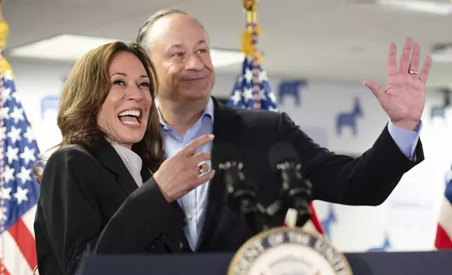 Vice President Kamala Harris, left, and second gentleman Doug Emhoff address staff at her campaign headquarters in Wilmington, Del., Monday, July 22, 2024. (Erin Schaff/The New York Times via AP, Pool)