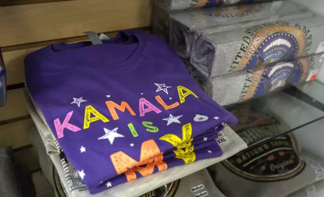 A t-shirt featuring Vice President Kamala Harris is on display next to a t-shirt with the Presidential seal, at the White House Gifts store, Sunday July 21, 2024, near the White House in Washington. She's already broken barriers, and now Harris could soon become the first Black woman to head a major party's presidential ticket after President Joe Biden's ended his reelection bid. The 59-year-old Harris was endorsed by Biden on Sunday, July 21, after he stepped aside amid widespread concerns about the viability of his candidacy.(AP Photo/Jacquelyn Martin)