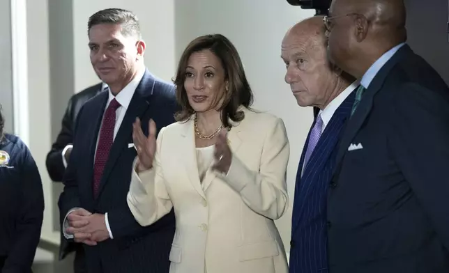 Democratic presidential candidate Vice President Kamala Harris talks after receiving a briefing on Hurricane Beryl recovery efforts at the City of Houston Emergency Operation Center in Houston, Wednesday, July 24, 2024, as Houston Mayor Houston Mayor John Whitmire, second from right, listens. (Brendan Smialowski/Pool via AP)