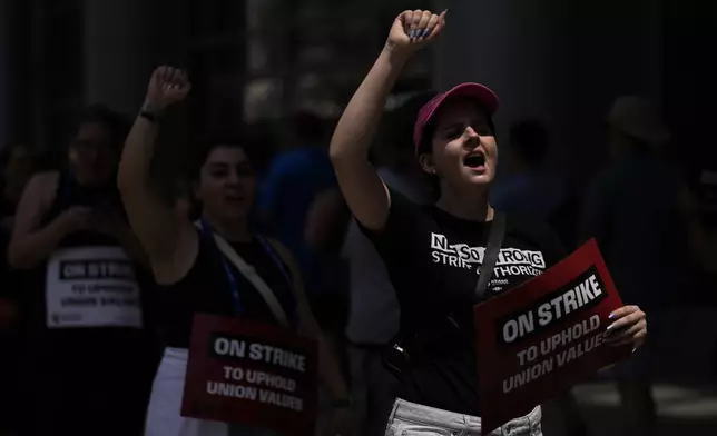 Demonstrators picket in support of the National Education Association Staff Organization outside the Pennsylvania Convention Center, Friday, July 5, 2024, in Philadelphia. (AP Photo/Matt Slocum)