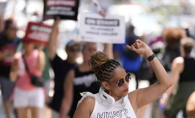 Demonstrators picket in support of the National Education Association Staff Organization outside the Pennsylvania Convention Center, Friday, July 5, 2024, in Philadelphia. (AP Photo/Matt Slocum)