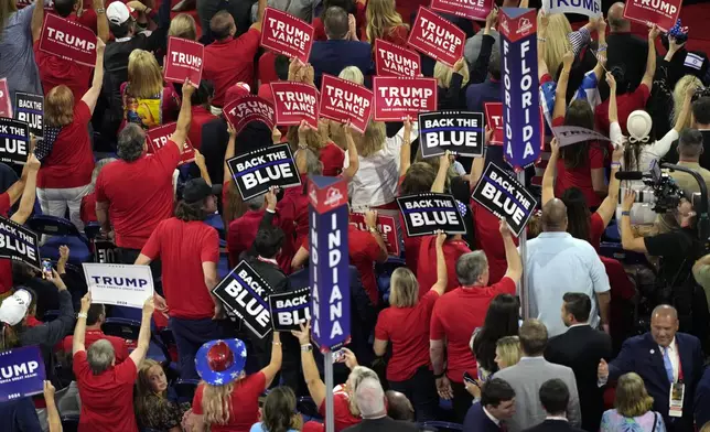 Delegates cheer during the 2024 Republican National Convention at the Fiserv Forum, Tuesday, July 16, 2024, in Milwaukee. (AP Photo/Carolyn Kaster)