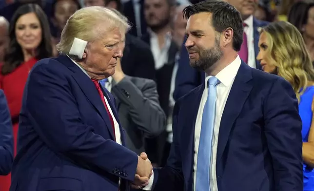 Republican presidential candidate former President Donald Trump and Republican vice presidential candidate Sen. JD Vance, R-Ohio, attend the first day of the Republican National Convention, Monday, July 15, 2024, in Milwaukee. (AP Photo/Evan Vucci)