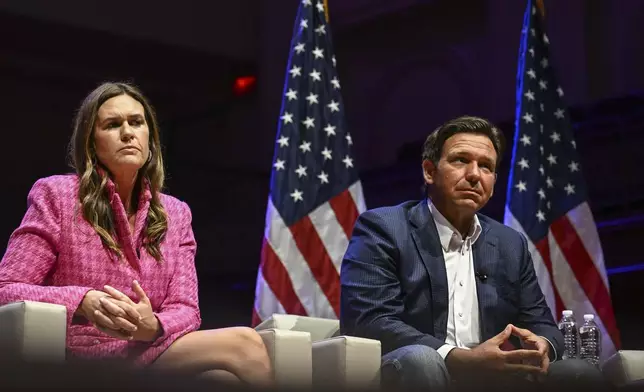 Arkansas Gov. Sarah Huckabee Sanders, and Florida Gov. Ron DeSantis take questions during a Mom's for Liberty function during the second day of the 2024 Republican National Convention near the Fiserv Forum, Tuesday, July 16, 2024, in Milwaukee. (AP Photo/Joe Lamberti)