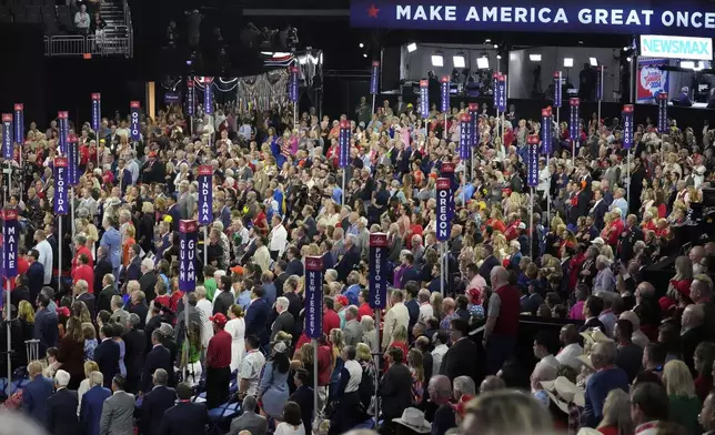 Delegates pray during the Republican National Convention Tuesday, July 16, 2024, in Milwaukee. (AP Photo/Nam Y. Huh)