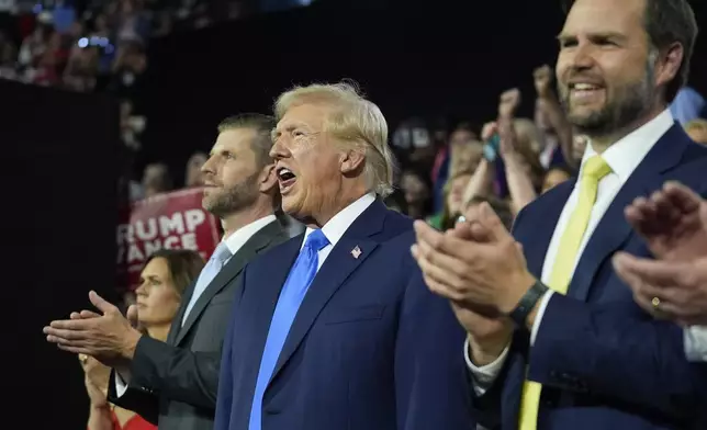 Republican presidential candidate former President Donald Trump arrives with Republican vice presidential candidate Sen. JD Vance, R-Ohio, during the second day of the Republican National Convention at the Fiserv Forum, Tuesday, July 16, 2024, in Milwaukee. (AP Photo/Evan Vucci)