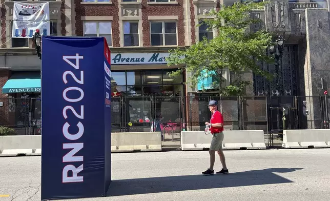 Outside of Downtown Market and Avenue Liquor on Thursday, July 18, 2024, in Milwaukee, Wis. This week's Republican National Convention didn't deliver an overwhelming victory to some small businesses in downtown Milwaukee. There had been earlier promises of an economic boost, but some bars, convenience stores and restaurants along the edge of the secure zone sat largely empty all week. (AP Photo/Patrick Orsagos)