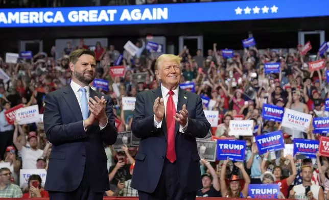 Republican presidential candidate former President Donald Trump and Republican vice presidential candidate Sen. JD Vance, R-Ohio, arrive a campaign rally, Saturday, July 20, 2024, in Grand Rapids, Mich. (AP Photo/Evan Vucci)