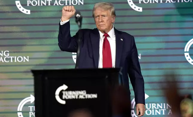 Republican presidential candidate former President Donald Trump gestures as he finishes speaking at The Believers' Summit 2024 at a Turning Point Action event in West Palm Beach, Fla., Friday, July 26, 2024. (AP Photo/Lynne Sladky)