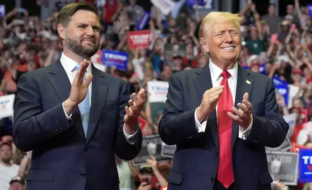 Republican presidential candidate former President Donald Trump and Republican vice presidential candidate Sen. JD Vance, R-Ohio, arrive a campaign rally, Saturday, July 20, 2024, in Grand Rapids, Mich. (AP Photo/Evan Vucci)