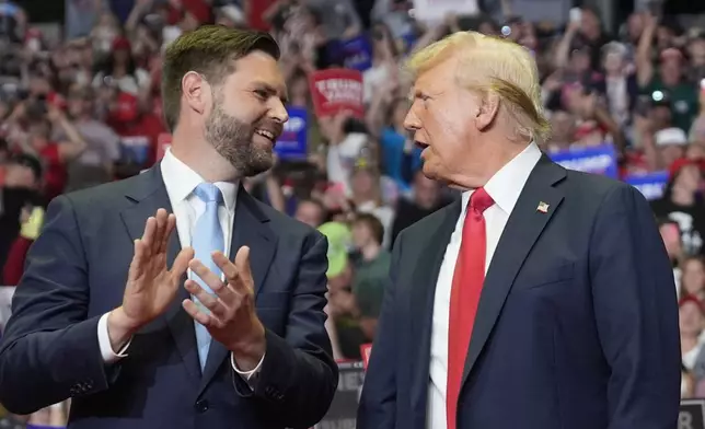 Republican presidential candidate former President Donald Trump and Republican vice presidential candidate Sen. JD Vance, R-Ohio, arrive a campaign rally, Saturday, July 20, 2024, in Grand Rapids, Mich. (AP Photo/Evan Vucci)