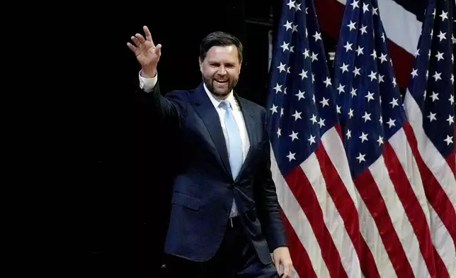 Republican vice presidential candidate Sen. JD Vance, R-Ohio, arrives to speak at a campaign event with Republican presidential candidate former President Donald Trump, Saturday, July 20, 2024, at Van Andel Arena in Grand Rapids, Mich. (AP Photo/Carlos Osorio)