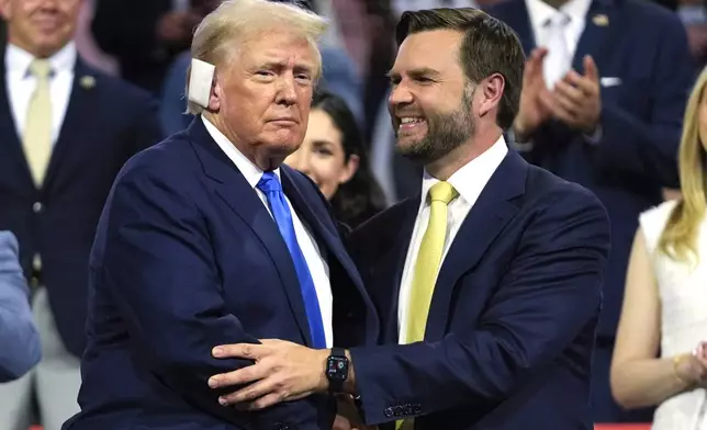 FILE - Republican presidential candidate former President Donald Trump, left, is introduced alongside Republican vice presidential candidate Sen. JD Vance, R-Ohio, during the Republican National Convention, July 16, 2024, in Milwaukee. Trump is returning to the campaign trail in Michigan as he looks to win a second term in office. Trump has spent much of the week at the RNC and the trip to Michigan will be his first campaign event since an assassination attempt in Pennsylvania on July 13. (AP Photo/Paul Sancya, File)