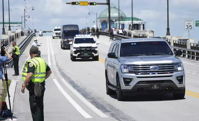 Protesters demonstrate as the motorcade of Israeli Prime Minister Benjamin Netanyahu arrives to meet with former President Donald Trump at Mar-a-Lago, Friday, July 26, 2024, in Palm Beach, Fla. (AP Photo/Jim Rassol)