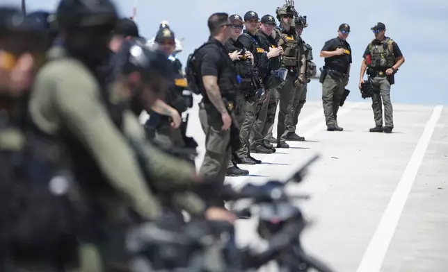 Security forces prepare for Israeli Prime Minister Benjamin Netanyahu's visit to Mar-a-Lago to meet with former President Donald Trump, Friday, July 26, 2024, in Palm Beach, Fla. (AP Photo/Jim Rassol)