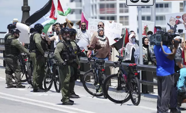 Protesters demonstrate against Israeli Prime Minister Benjamin Netanyahu's visit to Mar-a-Lago to meet with former President Donald Trump, Friday, July 26, 2024, in Palm Beach, Fla. (AP Photo/Jim Rassol)