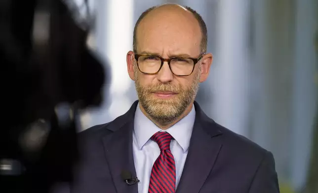 FILE - Acting director of Office of Management and Budget Russ Vought listens during a television interview at the White House, Oct. 21, 2019, in Washington. Former President Donald Trump is seeking to distance himself from a plan for a massive overhaul of the federal government drafted by some of his administration officials, including Vought. Some of these men are expected to take high-level roles if the Republican presumptive nominee is elected back into the White House. Trump is saying on Truth Social that he "knew nothing about Project 2025." (AP Photo/Alex Brandon, File)