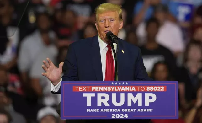 FILE - Republican presidential candidate former President Donald Trump speaks at a campaign rally, June 22, 2024, in Philadelphia. Trump is seeking to distance himself from a plan for a massive overhaul of the federal government drafted by some of his administration officials. Some of these men are expected to take high-level roles if the Republican presumptive nominee is elected back into the White House. Trump is saying on Truth Social that he "knew nothing about Project 2025." (AP Photo/Chris Szagola, File)