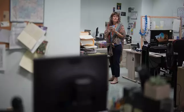 Donna Sybert, Managing Editor of the Butler Eagle newspaper, looks over the newsroom, Wednesday, July 17, 2024, in Butler, Pa. (AP Photo/Matt Slocum)