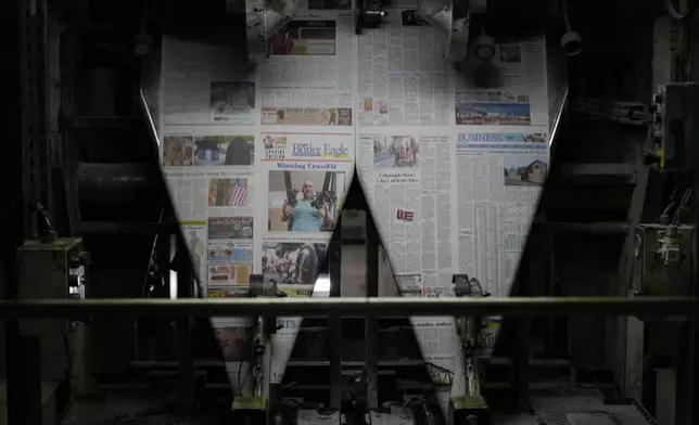 An edition of the Butler Eagle newspaper is run through the press, Thursday, July 18, 2024, in Butler, Pa. (AP Photo/Matt Slocum)