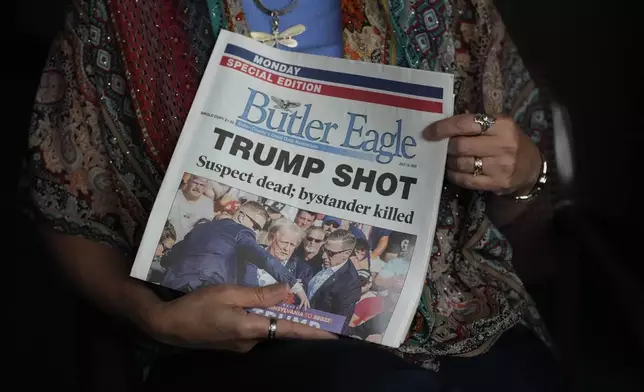 Donna Sybert, Managing Editor of the Butler Eagle newspaper, holds a Special Edition of the paper during an interview with The Associated Press, Wednesday, July 17, 2024, in Butler, Pa. (AP Photo/Matt Slocum)