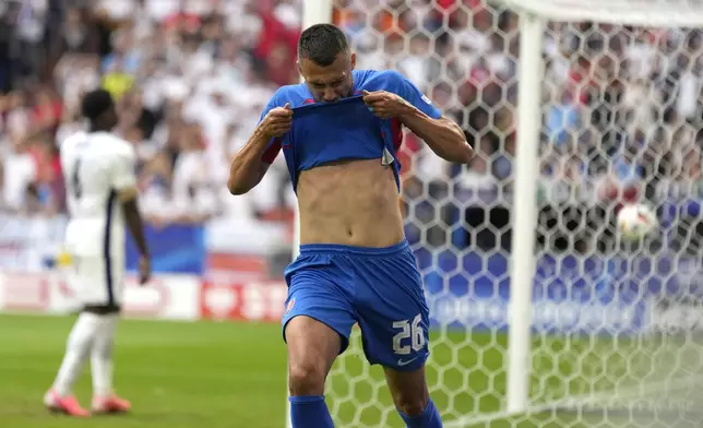 Slovakia's Ivan Schranz celebrates after scoring his side's opening goal during a round of sixteen match between England and Slovakia at the Euro 2024 soccer tournament in Gelsenkirchen, Germany, Sunday, June 30, 2024. (AP Photo/Ariel Schalit)