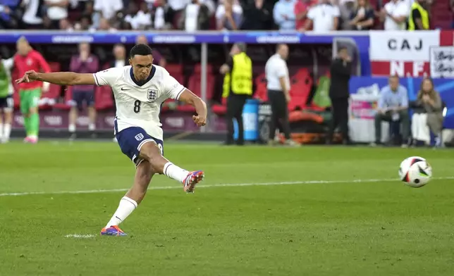 England's Trent Alexander-Arnold scores during the penalty shootout during a quarterfinal match between England and Switzerland at the Euro 2024 soccer tournament in Duesseldorf, Germany, Saturday, July 6, 2024. (AP Photo/Darko Vojinovic)