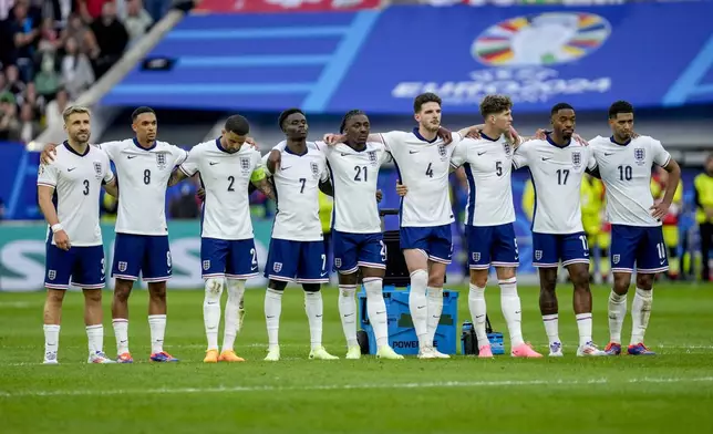 England players watch the penalty shootout during a quarterfinal match between England and Switzerland at the Euro 2024 soccer tournament in Duesseldorf, Germany, Saturday, July 6, 2024. (AP Photo/Darko Vojinovic)