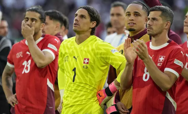 Switzerland's players react after losing against England after the penalty shootout during a quarterfinal match between England and Switzerland at the Euro 2024 soccer tournament in Duesseldorf, Germany, Saturday, July 6, 2024. (AP Photo/Frank Augstein)