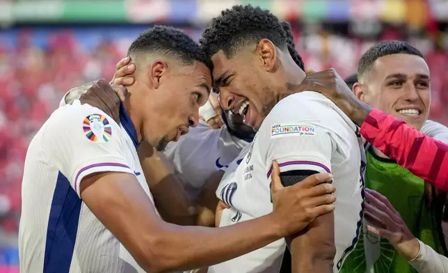 England's Jude Bellingham, right, and England's Trent Alexander-Arnold celebrate after a quarterfinal match between England and Switzerland at the Euro 2024 soccer tournament in Duesseldorf, Germany, Saturday, July 6, 2024. (AP Photo/Darko Vojinovic)