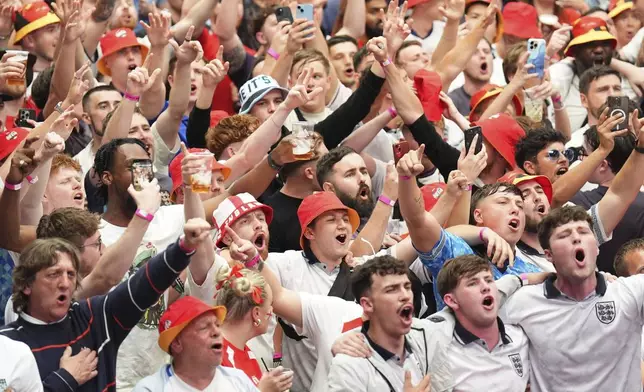 England fans gather at BOXPark, Wembley, London, Saturday, July 6, 2024, to watch a screening of the quarterfinal match between England and Switzerland at the Euro 2024 soccer tournament played in Duesseldorf, Germany. (James Manning/PA via AP)