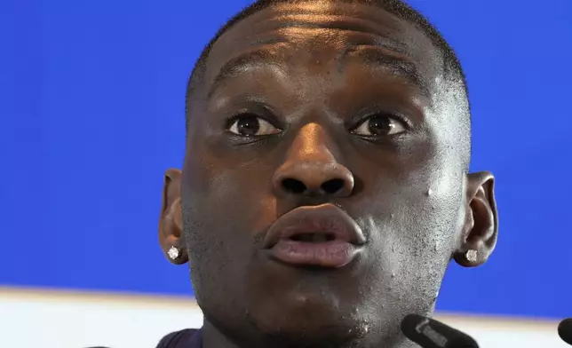 France's Randal Kolo Muani speaks during a press conference in Paderborn, Germany, Sunday, July 7, 2024. France will play against Spain during their semifinal soccer match at the Euro 2024 soccer tournament on July 9. (AP Photo/Hassan Ammar)