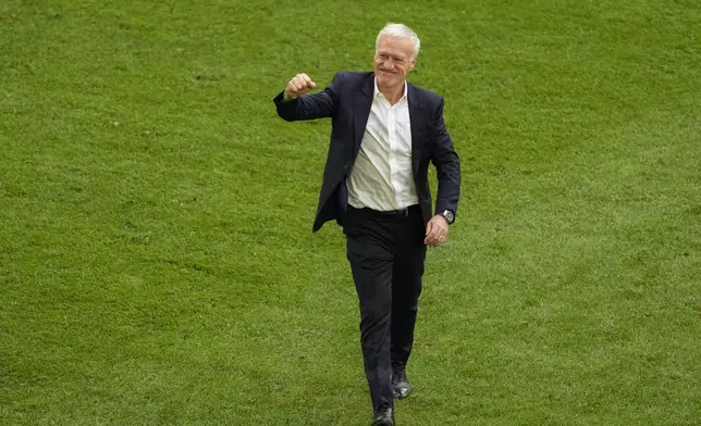 France head coach Didier Deschamps celebrates at the end of a round of sixteen match between France and Belgium at the Euro 2024 soccer tournament in Duesseldorf, Germany, Monday, July 1, 2024. (AP Photo/Andreea Alexandru)