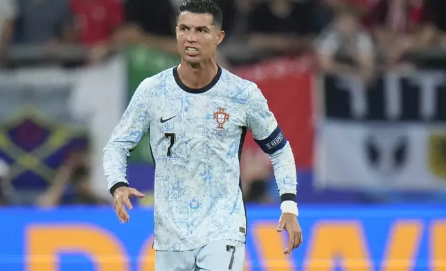 Portugal's Cristiano Ronaldo grimaces during a Group F match between Georgia and Portugal at the Euro 2024 soccer tournament in Gelsenkirchen, Germany, Wednesday, June 26, 2024. (AP Photo/Alessandra Tarantino)