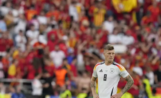 Germany's Toni Kroos looks on at the end of a quarter final match between Germany and Spain at the Euro 2024 soccer tournament in Stuttgart, Germany, Friday, July 5, 2024. (AP Photo/Ariel Schalit)