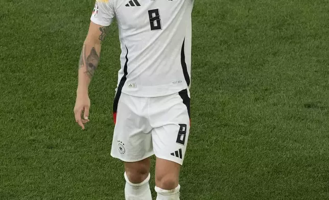 Germany's Toni Kroos blows a kiss at the end of a quarter final match between Germany and Spain at the Euro 2024 soccer tournament in Stuttgart, Germany, Friday, July 5, 2024. Spain won the team 2-1. (AP Photo/Michael Probst)