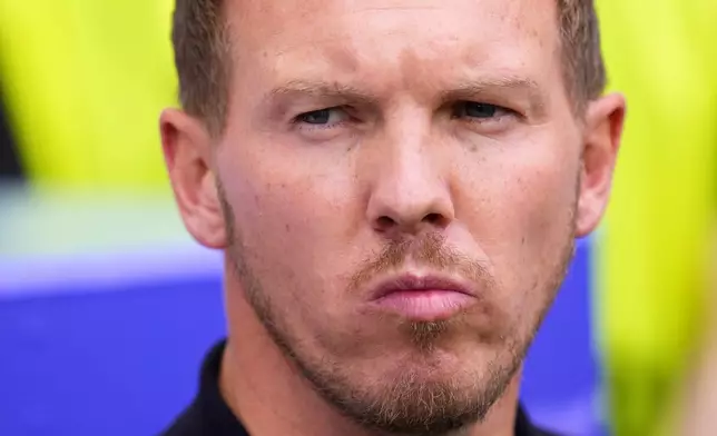 Germany's head coach Julian Nagelsmann concentrates before a quarter final match between Germany and Spain at the Euro 2024 soccer tournament in Stuttgart, Germany, Friday, July 5, 2024. (AP Photo/Manu Fernandez)