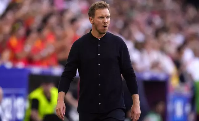 Germany's head coach Julian Nagelsmann grimaces during a quarter final match between Germany and Spain at the Euro 2024 soccer tournament in Stuttgart, Germany, Friday, July 5, 2024. (AP Photo/Manu Fernandez)