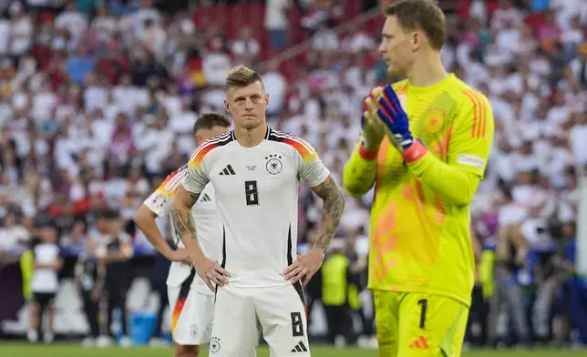 Germany's Toni Kroos looks on at the end of a quarter final match between Germany and Spain at the Euro 2024 soccer tournament in Stuttgart, Germany, Friday, July 5, 2024. (AP Photo/Ariel Schalit)