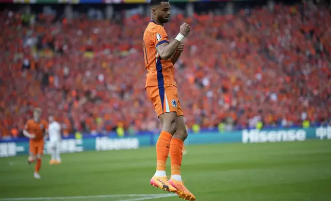 Cody Gakpo of the Netherlands celebrates his goal during a Group D match between Netherlands and Austria at the Euro 2024 soccer tournament in Berlin, Germany, Tuesday, June 25, 2024. (AP Photo/Ebrahim Noroozi)