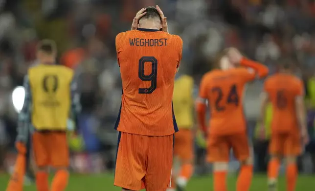 Wout Weghorst of the Netherlands leaves the pitch after a semifinal match between the Netherlands and England at the Euro 2024 soccer tournament in Dortmund, Germany, Wednesday, July 10, 2024. England won 2-1. (AP Photo/Darko Vojinovic)